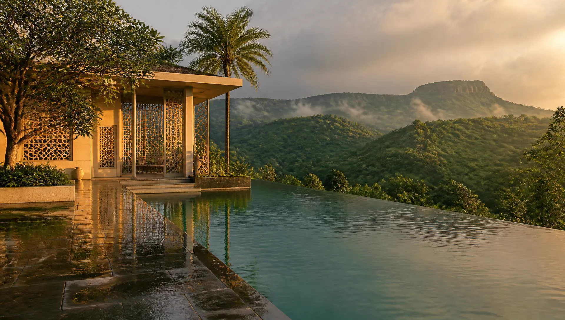 Infinity pool at an oceanfront villa at blue hour