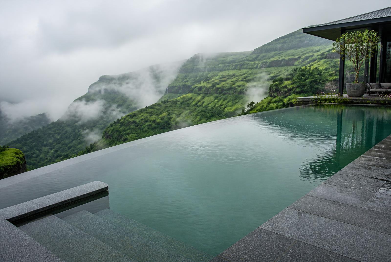 Reinforced membrane liner pool at a Lonavala hill resort in the monsoon mist